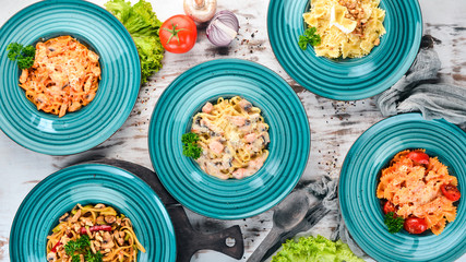 Pasta Set of Italian pastes. On a wooden background. Top view. Copy space.
