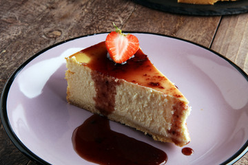 Homemade cheesecake with fresh strawberries and mint for dessert - healthy organic summer dessert pie cheesecake. Vanilla Cheese Cake.