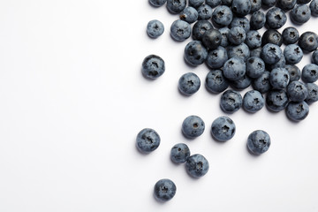 Flat lay composition with tasty blueberry and space for text on white background