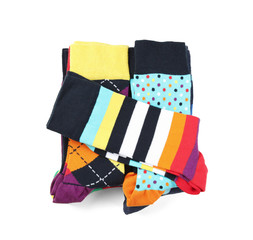 Colorful socks on white background, top view