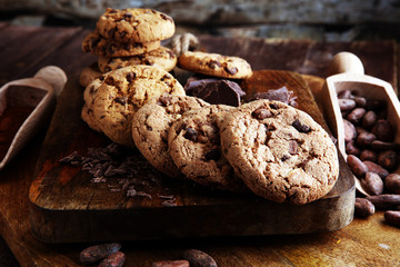 Chocolate cookies on wooden table. Chocolate chip cookies shot