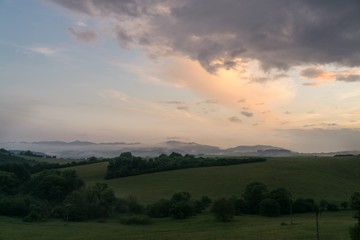 Obraz premium Sunrise and sunset over the hills and town. Slovakia