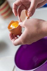 Separate egg yolk and egg white - close-up