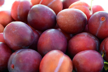 A bowl with plums. Close-up.