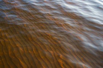 texture of water and sand in a solar array