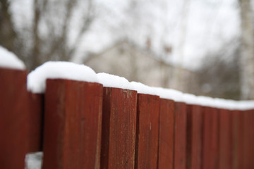 Snow covered fence
