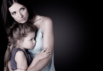 Portrait  of sad Mother with daughter