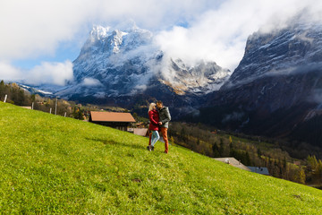 Fototapeta na wymiar guy and girl in the Swiss mountains in autumn