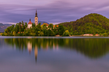 Fototapeta na wymiar Lake Bled Slovenia. Beautiful mountain lake with small Pilgrimage Church. 