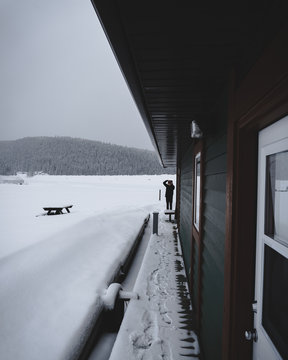 Photographer taking photo on frozen lake barge