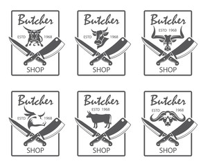 collection of monochrome butcher shop emblems with kithen crossed knives and cow