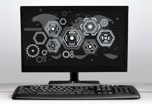 Desktop computer and keyboard on background
