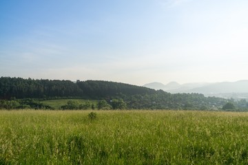 Fototapeta premium Sunrise and sunset over the hills and town. Slovakia