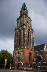 the beautiful Martinitower from Groningen in Netherlands. Background with dramatic clouds.