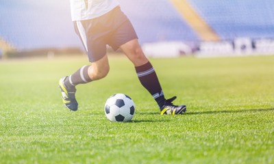 Running soccer player on grass © BillionPhotos.com