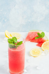 Watermelon fresh beverage with lemon and mint in glass