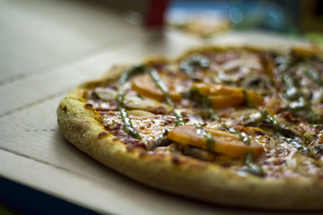 Pizza on cardbox. Selective focus