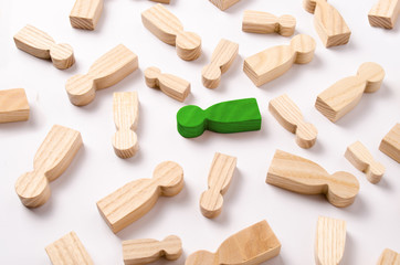 Wooden figures of people are lying on a white background. The concept of human resources management. Headhunters. Search for people to work. The search for the second half. Social network. Business
