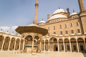 The courtyard of the Great Mosque of Muhammad Ali Pasha. Prayers and tourists in the mosque.