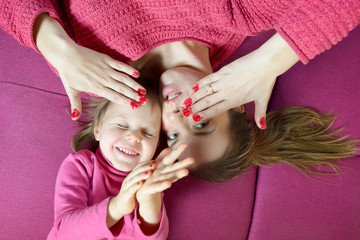 Mom and daughter having fun together
