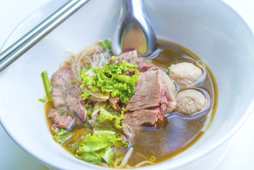 Chinese noodles with braised beef and meatball delicious Chinese style Asian favorite Thai street food.