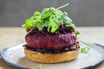 Beetroot and red beans burger in the brioche bun