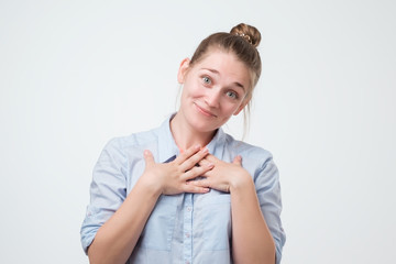 Pleased caucasian woman smiling broadly, glad to receive compliments from friends