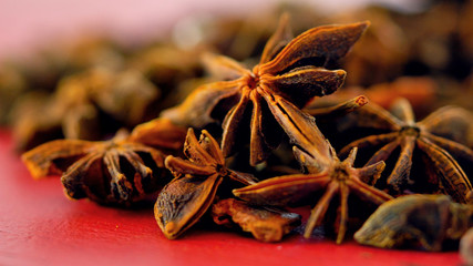 Colorful cooking spices macro closeup. on vintage red wood table, selective focus.
