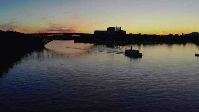 Aerial view of a steamboat voyaging over bay Riddarfjarden late at night in Stockholm, Sweden