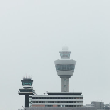 airport traffic control tower at foggy weather