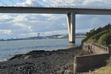 The original Forth Road Bridge crossing the River Forth, seen from beneath at North Queensferry,...