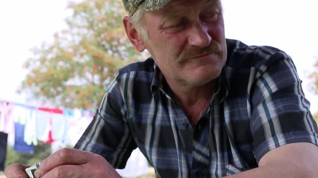 working old man talking