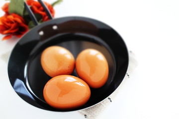 Raw egg on frying pan for cooking image