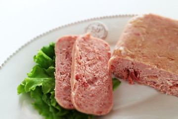 Canned food, luncheon meat on wooden plate