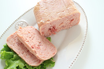 Canned food, luncheon meat on wooden plate
