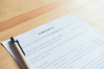 Obraz premium closeup of signing a documentation agreement and pen on the table.