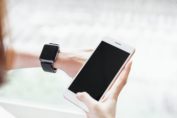Woman using Blank screen smartphone for the application. Concepts for digital technology in everyday life.