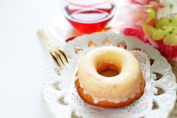 Icing donut on dish for afternoon tea image