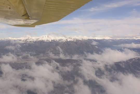 Small Airplane Flying Over the San Carlos de Bariloche. Patagonia, Argentina. 