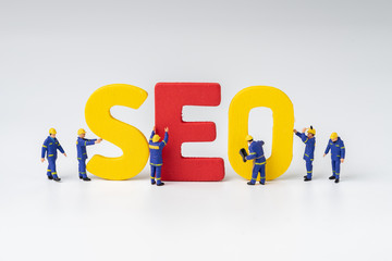 SEO, Search Engine Optimization ranking concept, miniature people figure workers team building...