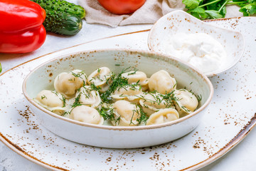 Dumplings with sour cream and herbs