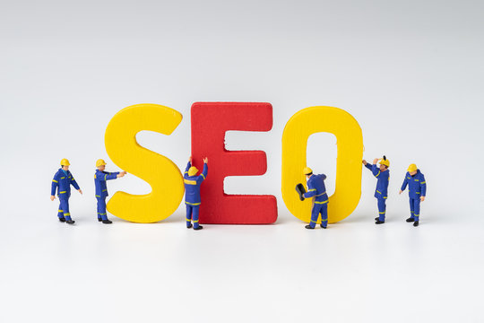 SEO, Search Engine Optimization ranking concept, miniature people figure workers team building alphabets abbreviation SEO on white background , the idea of promote traffic to website