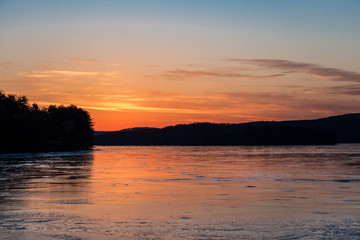 Fototapeta na wymiar Sunset on frozen lake
