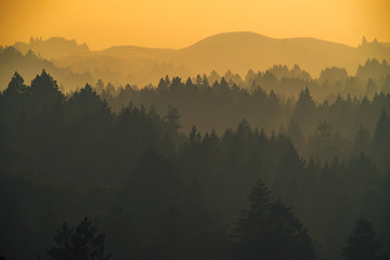 Smoke from the summer 2018 California wildfires glows under the setting sun