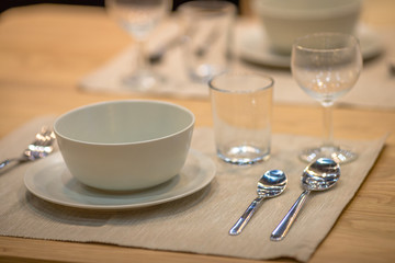 Background, table setting (spoon, glass, plate) placed on the knob to be beautiful and convenient to use.