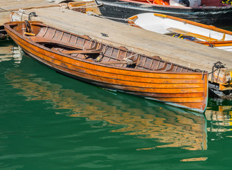 Fototapeta na wymiar Old Wooden Boat Tied to Dock