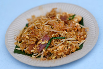 Penang famous hawker food stir fried noodles or called Char Koay Teow served on plate