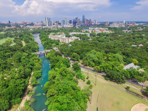 Aerial view Downtown from Barton Creek in Greenbelt at Zilker Metropolitan Park south Austin with summer blue cloud sky. Located at eastern edge of Hill Country, Austin the state capital of Texas, US.