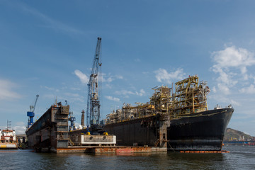 Fototapeta premium Docks in Rio de Janeiro with old ships being repaired or disassembled