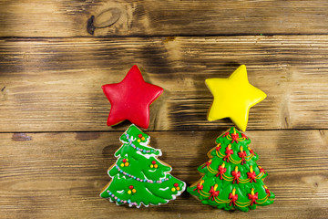 Festive tasty Christmas gingerbread cookies on wooden table. Top view